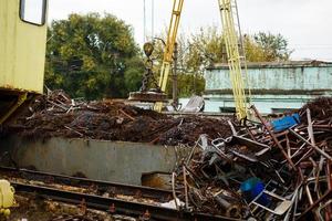 Recycling of scrap metal from demolished building photo