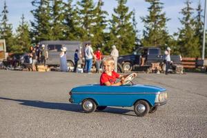 2022-08-12 Tatarstan, Verkhneuslonsky district, village. Savino. Resort town Sviyazhsky hills. Kazan Festival of Historical Technologies. Children ride on children's retro cars photo