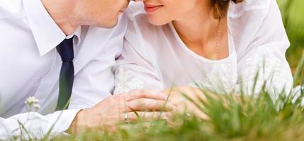 The bride and groom on the background of a mountain stream photo