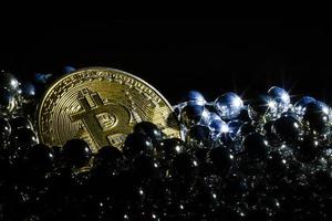 Golden bitcoin on black background with copy space cryptocurrency mining concept  silver photo