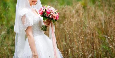 Wedding bouquet in bride s hands photo