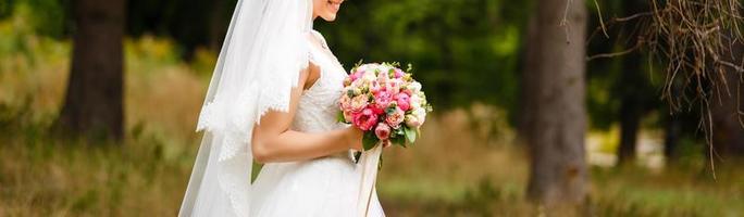 Wedding bouquet in bride s hands photo