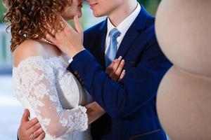 Happy bride and groom at a park on their wedding day photo