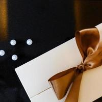 gift envelope with gold ribbon photo