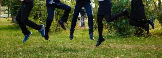 Kids jumping in a orchard summer day photo