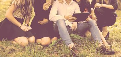 Group of friends with tablet pc photo