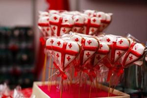 Chocolate filled heart cookie pops for Valentine Day decor Georgian flag photo