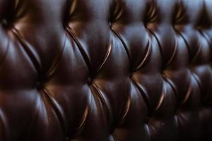 Genuine leather upholstery background for a luxury decoration in Brown tones photo