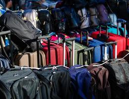 Many travel suitcases photo