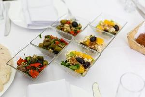 snacks in small glass plates photo