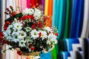 bouquet of flowers with roses and chamomiles photo