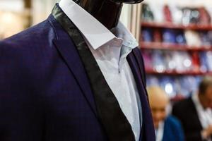 Suit in a showcase of a luxury store photo