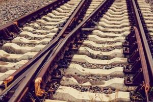 The railroad tracks stretch into the distance photo