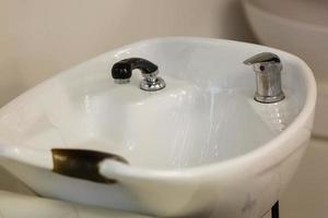 Beauty salon interior a row of hair washing sinks photo