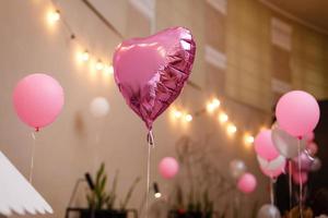 Decorations on birthday. White and pink balloons. photo