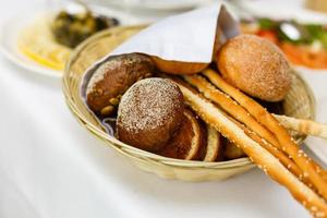 Delicious freshly baked pastry filled with cheese Buns bread in a basket table photo