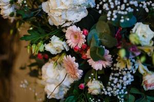 archway of many beautiful flowers, wedding arch with peonies Flowers for a wedding arch photo