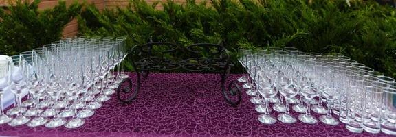 Beautiful champagne glasses defocused on buffet table in restaurant and blurred background photo