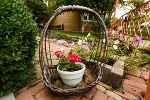 decorative wicker basket, street decor, flower pot photo