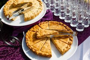 meat pie sliced on a white plate photo