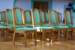 turquoise chairs at the ceremony photo