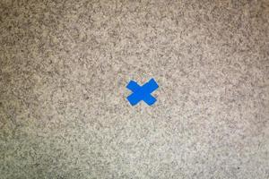 Blue  Cross on White Abstract Pattern background. Macro Video Image from Television Screen photo
