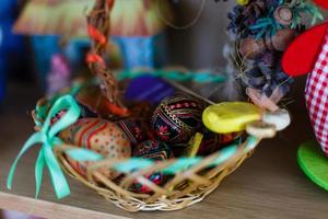 Easter basket with decorated eggs photo