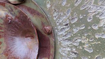 War in Ukraine, a hole in the armor of an infantry fighting vehicle, armor pierced. Texture of green camouflage armored metal with damage and holes. Destroyed military armored personnel carrier. video