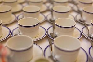 coffee cups served on white table as at coffee shop photo