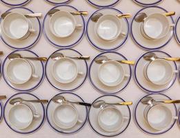 coffee cups served on white table as at coffee shop photo