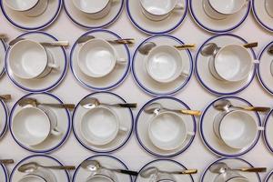 coffee cups served on white table as at coffee shop photo