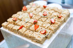 mini cakes with chocolate and strawberries photo