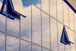 modern blue glass wall of skyscraper Office building close up photo