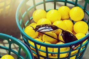 Golf balls pouring out of basket in Kiev golf club Golfstreem. 29 March 2015 Kiev. Ukraine photo