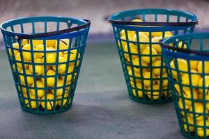 Golf balls pouring out of basket in Kiev golf club Golfstreem. 29 March 2015 Kiev. Ukraine photo