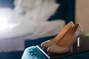 Bride's shoes and dress photo