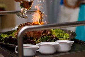 Chef, Meat poured alcohol and set fire to photo