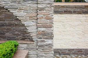 Stone background of decorative wall made of sandstone photo