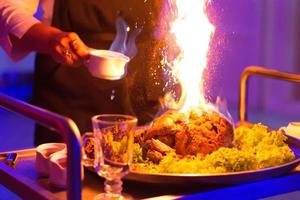 Chef, Meat poured alcohol and set fire to photo