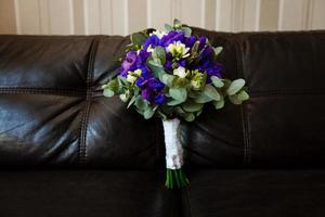 Blue bouquet on a leather sofa photo