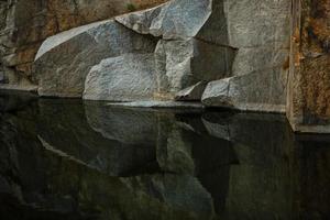 Quarry rocks with reflection photo