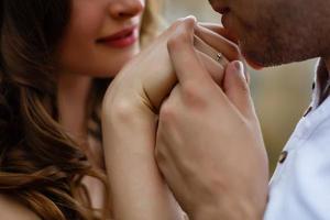 Man kissing woman's hand photo