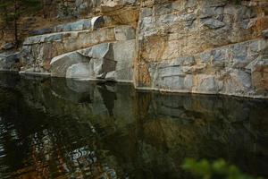 Quarry rocks with reflection photo