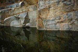 Quarry rocks with reflection photo