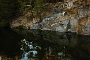 Quarry rocks with reflection photo