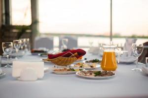 orange juice, croissants and strawberries still life photo