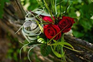 Red roses in decorative bouquet with crystals on it photo