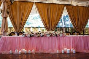 a laid wedding banquet table at a restaurant photo