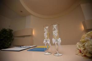 wedding glasses and wedding decor with flowerds photo