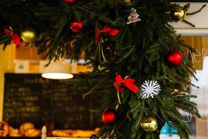 Christmas decorative with snowflake on christmas tree and bokeh light background. photo